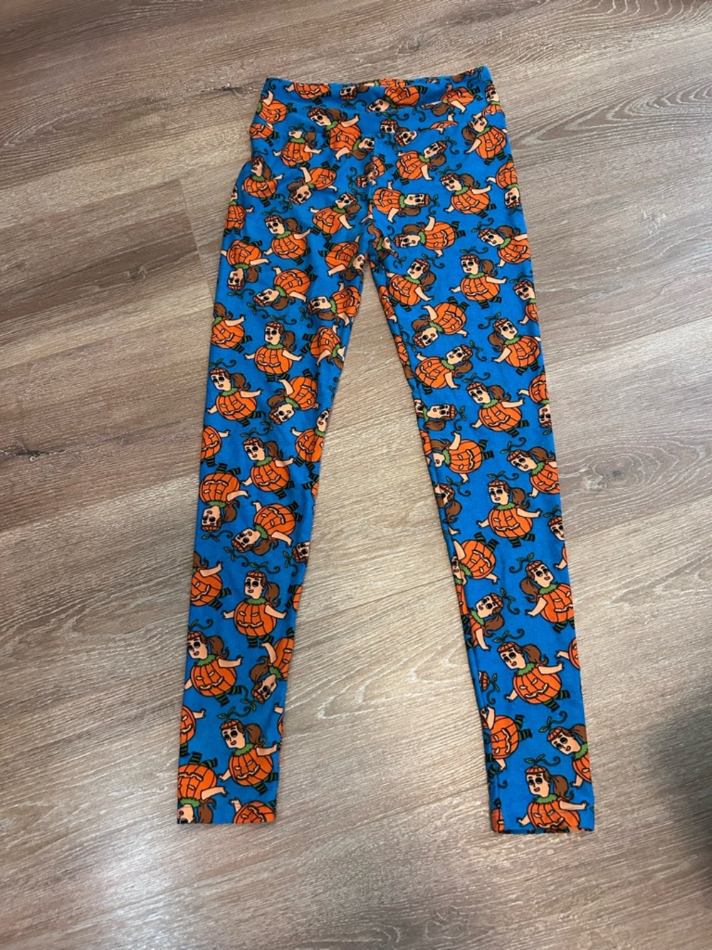 LuLaRoe Blue Leggings with Orange Pumpkin Character Print